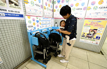 Image1:A father holding his baby